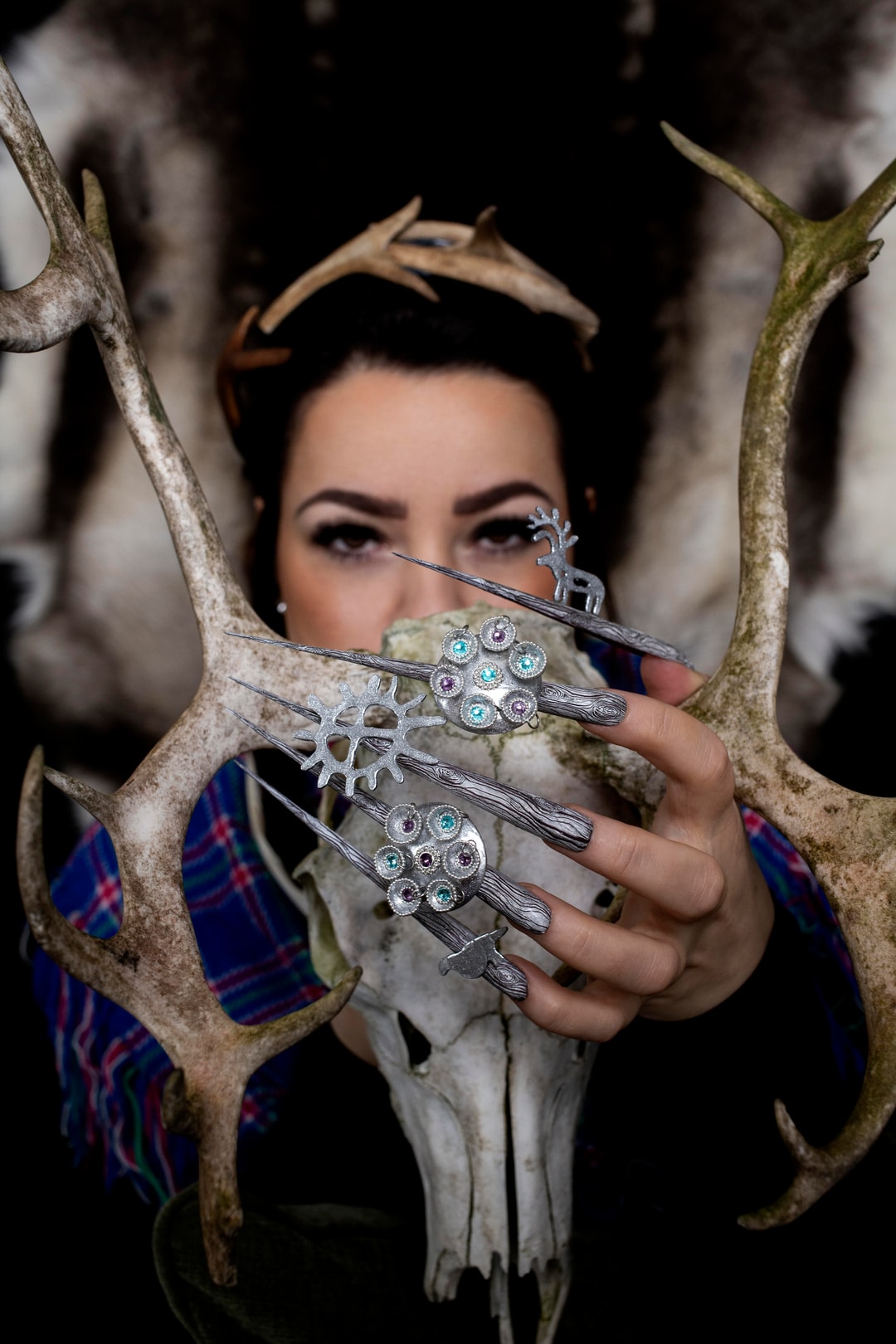 finger,hand,person,antler,woman,adult,female,face,head,accessories
