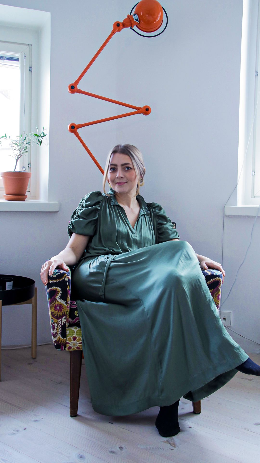 clothing,furniture,evening dress,robe,gown,fashion,person,home decor,sleeve,female