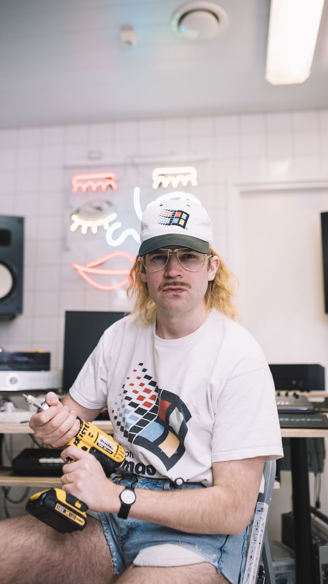 person,clothing,monitor,screen,electronics,lcd screen,finger,hat,cap,pc