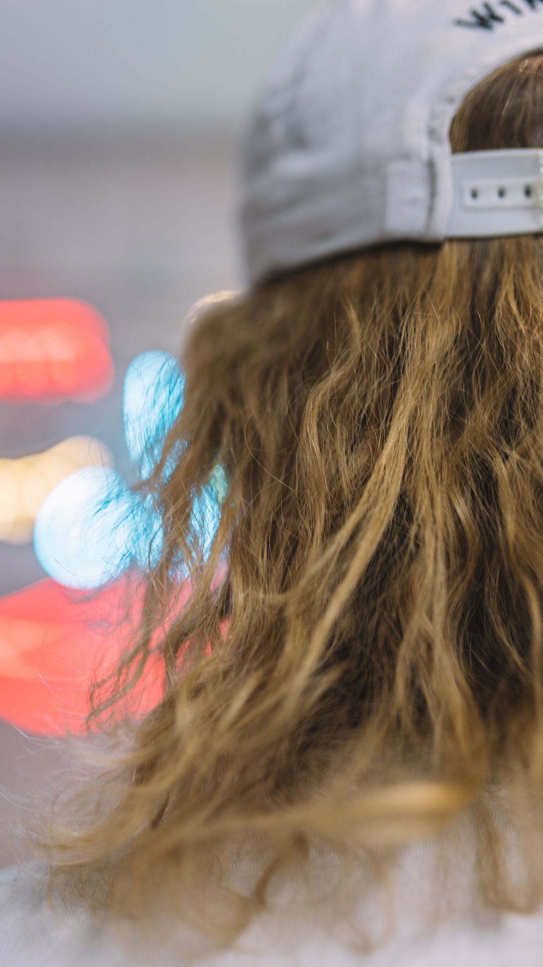 hair,clothing,apparel,person,human,hat,crowd,dye,back