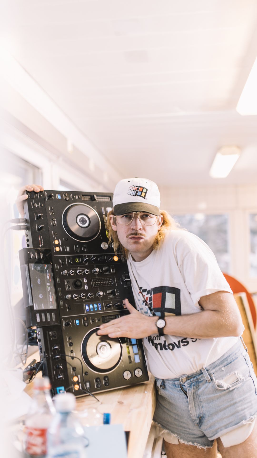 person,human,hat,clothing,camera,electronics,pants,cap,leisure activities,baseball cap