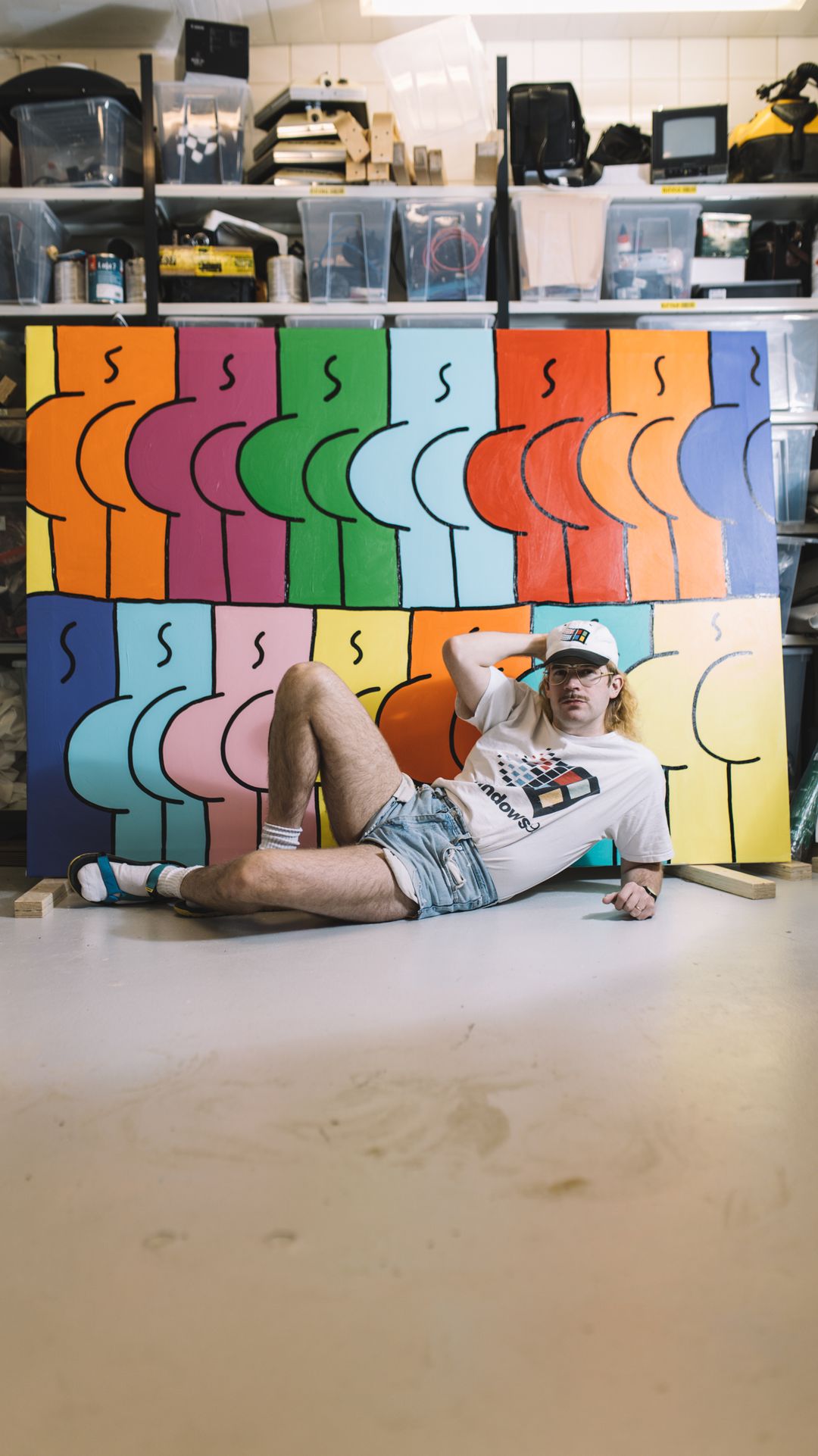 person,clothing,shorts,wood,sunglasses,floor,flooring,pants,plywood,shoe